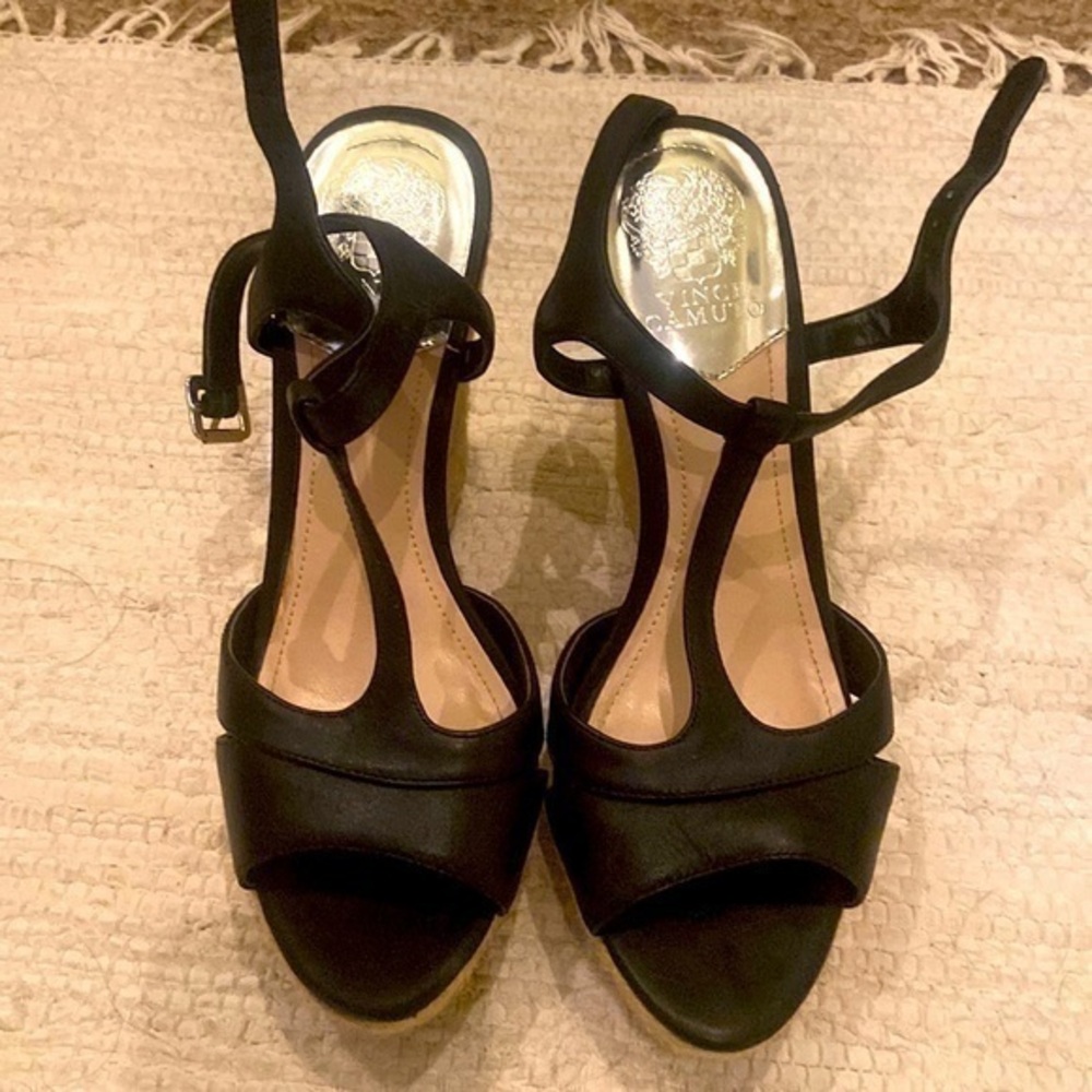 Black strappy wedge shoes.
